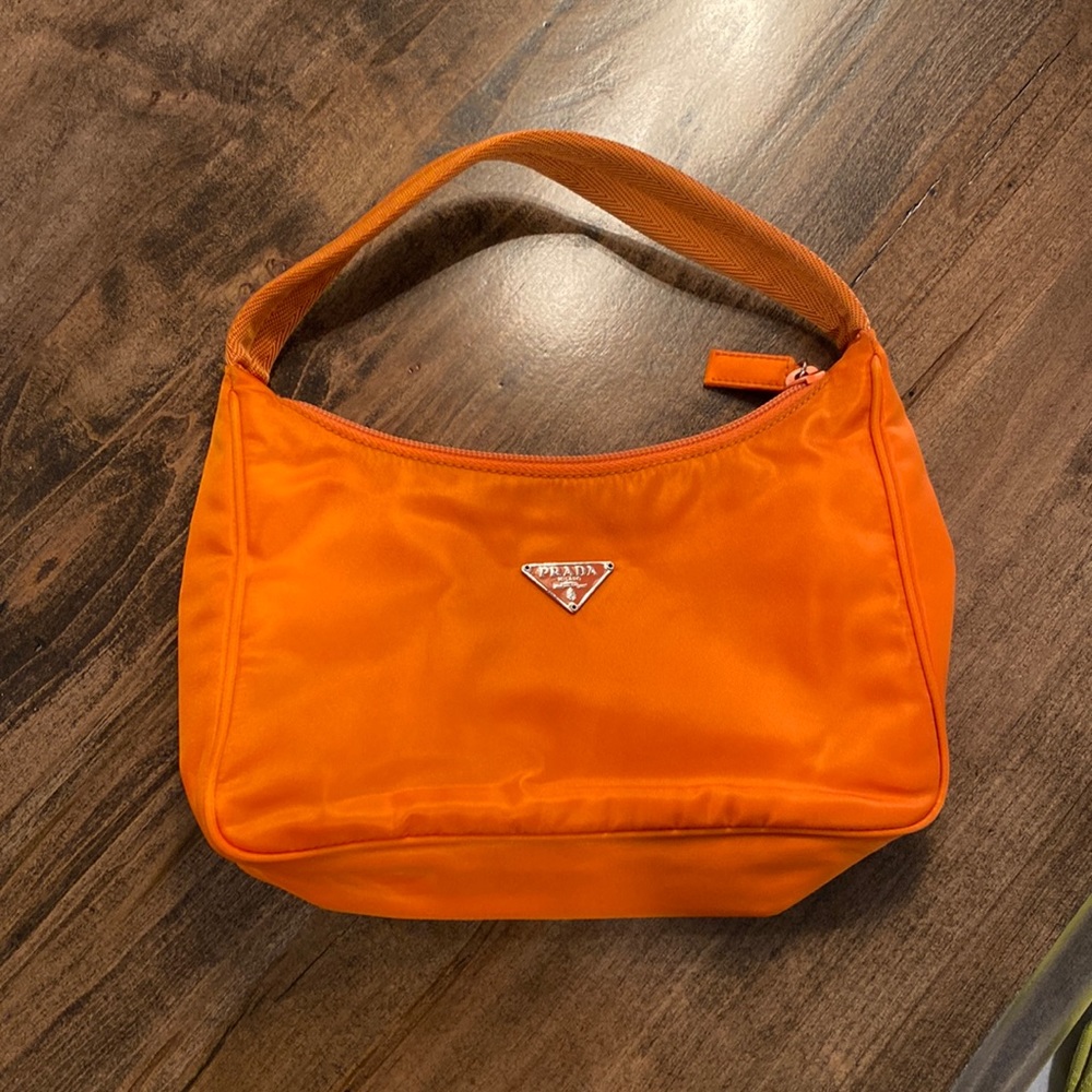 Prada orange silk material small handbag.